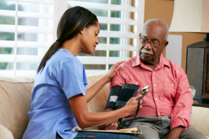 a nurse visit the elderly man at home